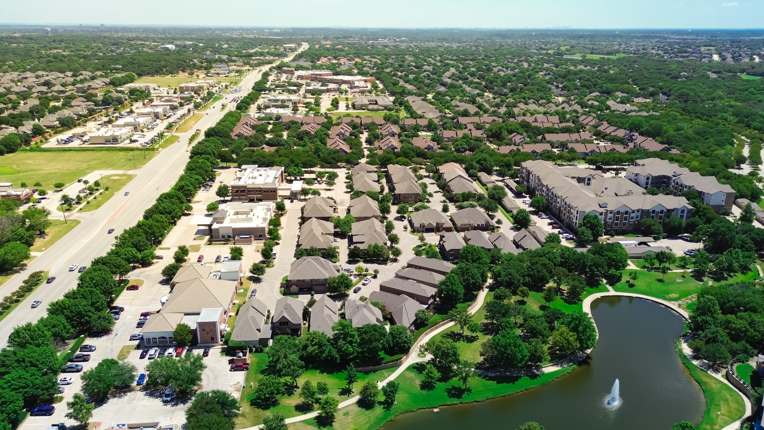 Busy Keller Parkway with homes and lawns, highlighting Keller Lawn Care and Keller Mosquito Control services.