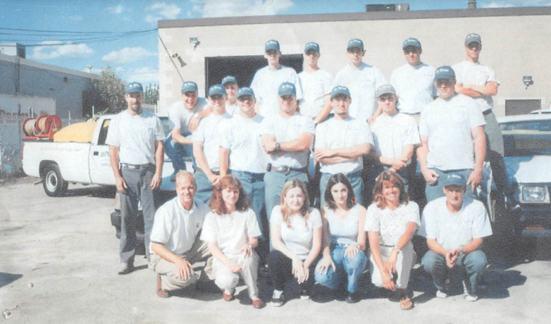 The original Dr. Green Services team from 1986, showcasing our long-standing commitment to lawn care.