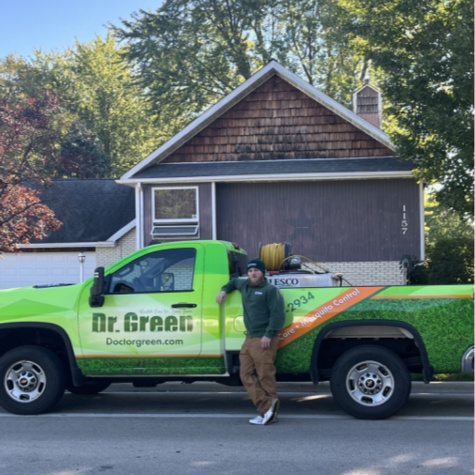 Marc Harris, Operations Manager, standing in front of a Dr. Green Services truck.