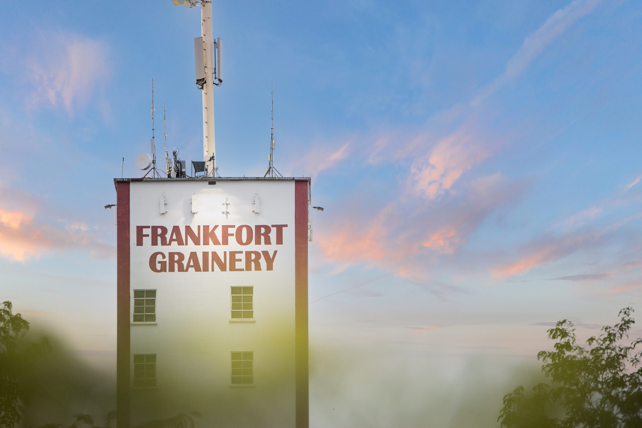 Historic Frankfort Grainery surrounded by a green, well-maintained lawn cared for by Dr. Green Services.
