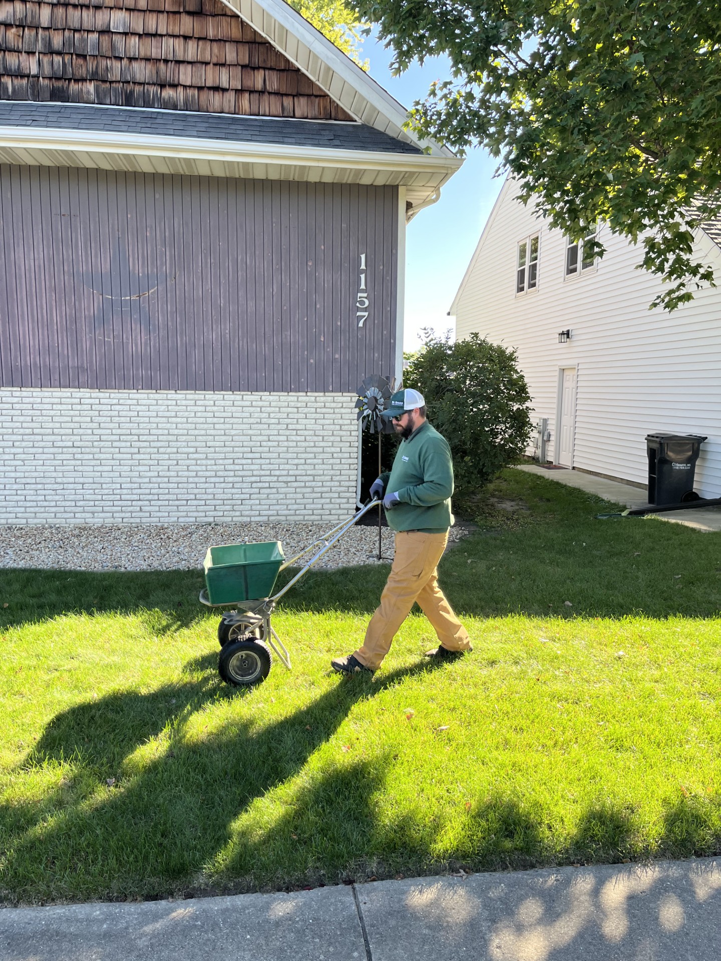 Certified Dr. Green Services technician providing expert care for Dyer lawn care, ensuring a green and weed-free lawn.