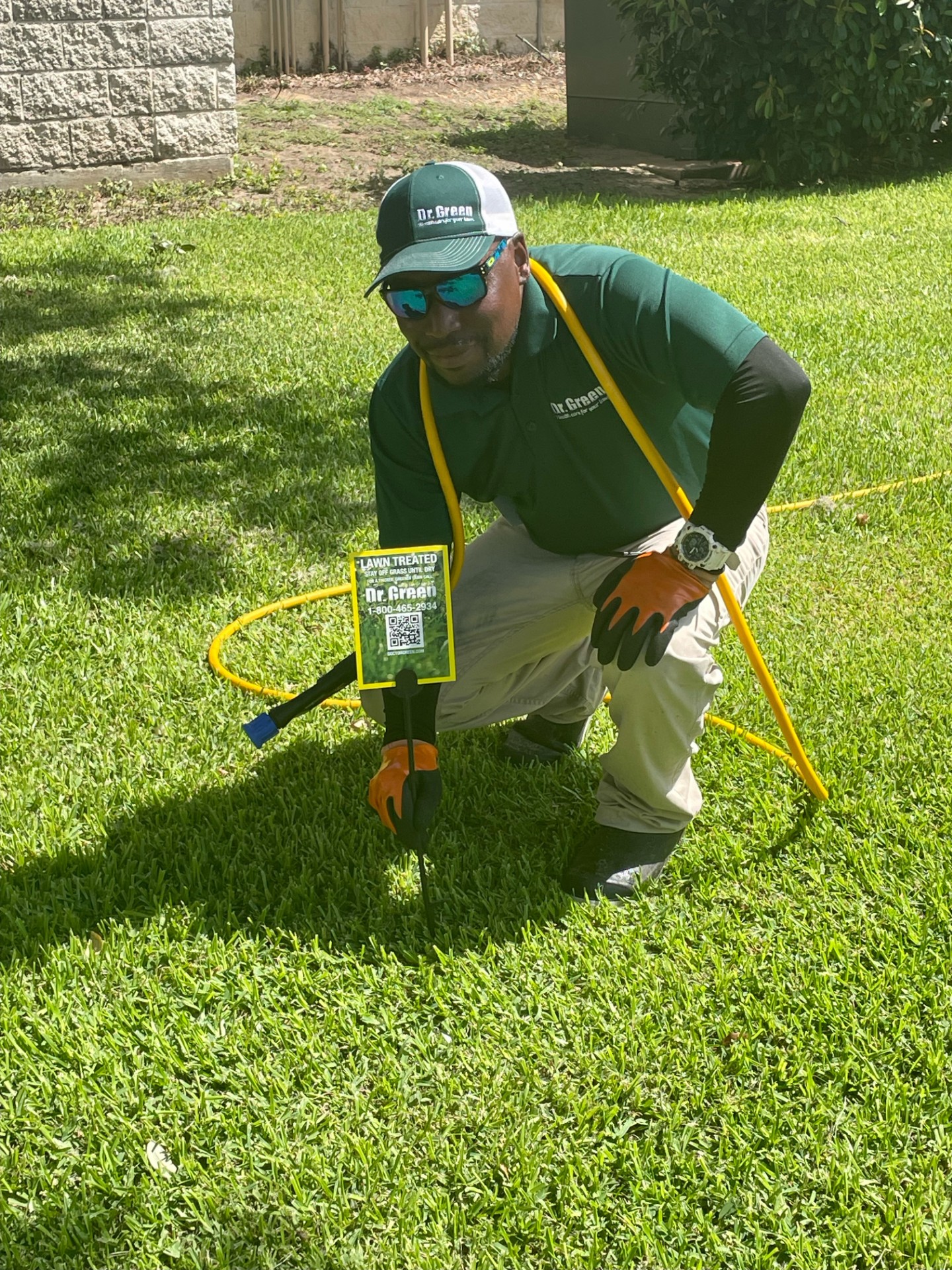 Certified technician from Dr. Green Services maintaining a healthy and green lawn in The Colony.