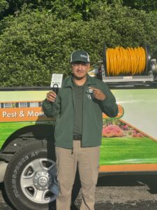 Dr. Green Services technician applying lawn treatment to control weeds 