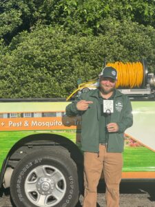 Dr. Green Services technician applying lawn treatment for weed control 