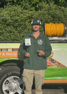 Dr. Green Services technician applying lawn weed control.