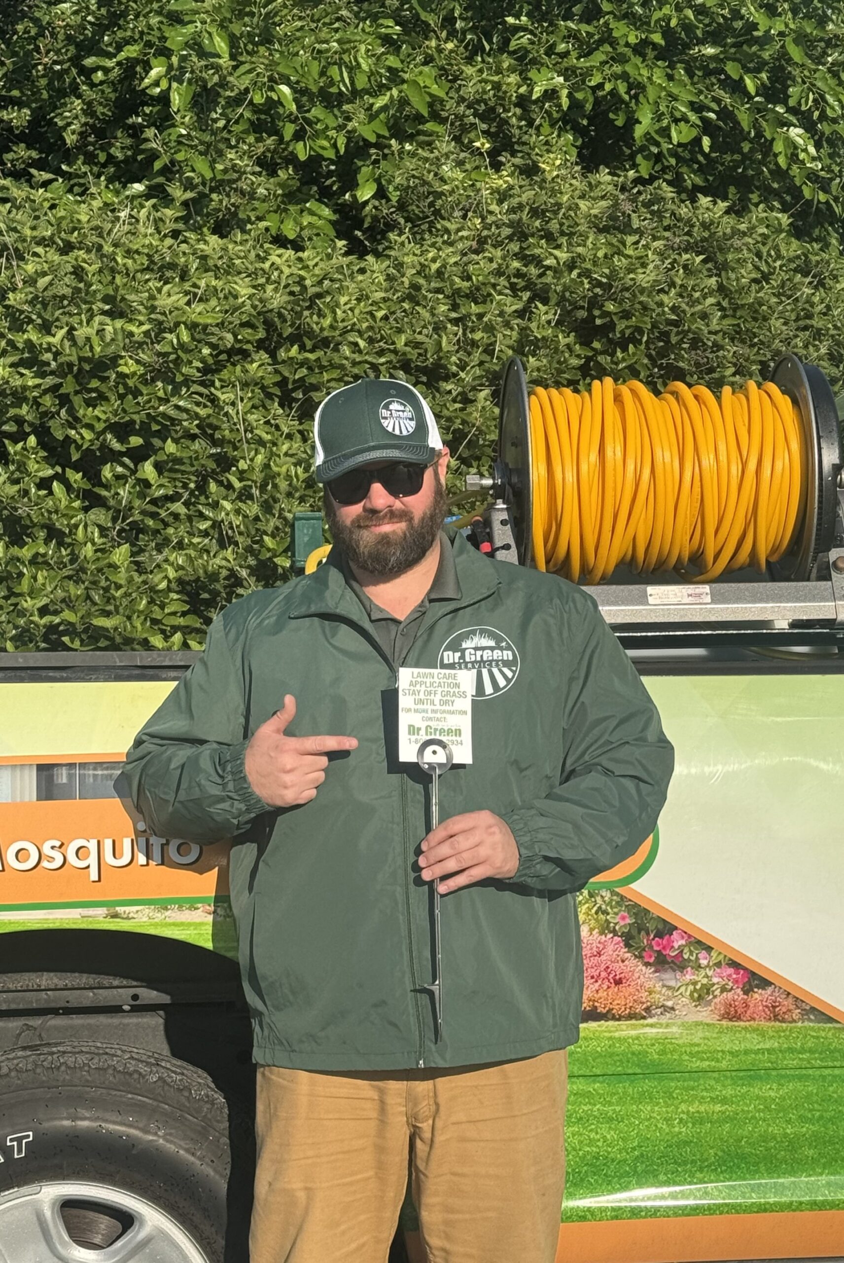 Dr. Green Services technician performing lawn care in Sugar Grove