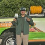 Alex, one of Dr. Green Services’ certified lawn care technicians, providing expert lawn treatments in Illinois.