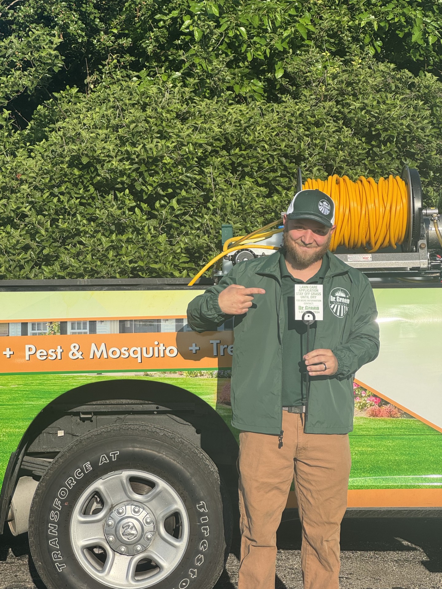 Dr. Green Services technician caring for a healthy, green, weed-free lawn in Heath, TX